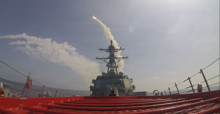 This image provided by U.S. Central Command shows the Arleigh Burke-class guided-missile destroyer USS Frank E. Petersen Jr. (DDG 121)) firing a Tomahawk Land Attack Missile (TLAM) in support of Operation Epic Fury, on Saturday, Feb. 28, 2026. (U.S. Navy via AP)