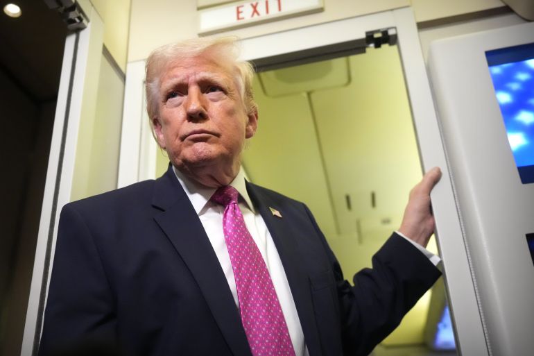 President Donald Trump speaks to reporters aboard Air Force One en route from West Palm Beach, Fla., to Joint Base Andrews, Md., Sunday, March 29, 2026. (AP Photo/Mark Schiefelbein)