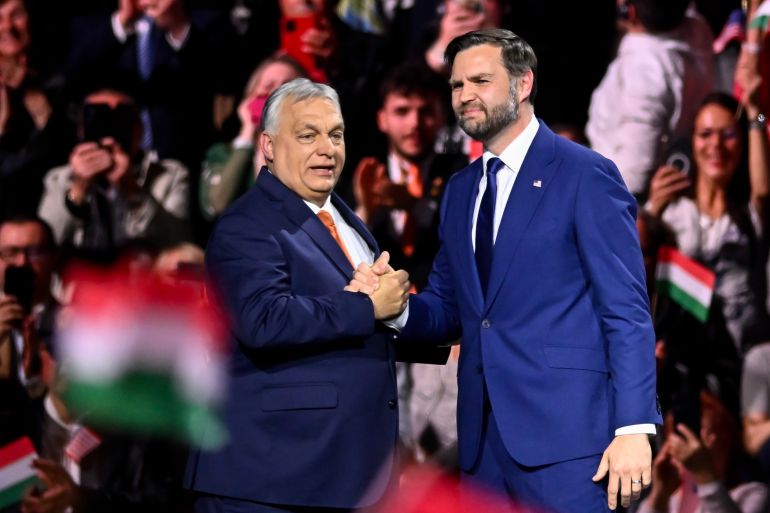 Hungary's Prime Minister Viktor Orban, left, and U.S. Vice President JD Vance shake hands at the end of a pre-election rally in Budapest, Hungary, Tuesday, April 7, 2026. (AP Photo/Denes Erdos)