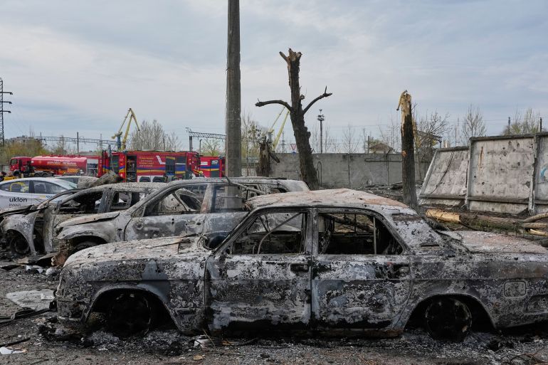 Burnt private cars on a damaged parking site following Russia's missile attack in Kyiv, Ukraine, Thursday, April 16, 2026. (AP Photo/Efrem Lukatsky)