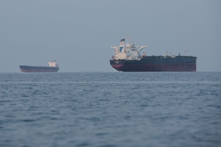 Tankers anchored in the Strait of Hormuz off the coast of Qeshm Island, Iran, Saturday, April 18, 2026. (AP Photo/Asghar Besharati)