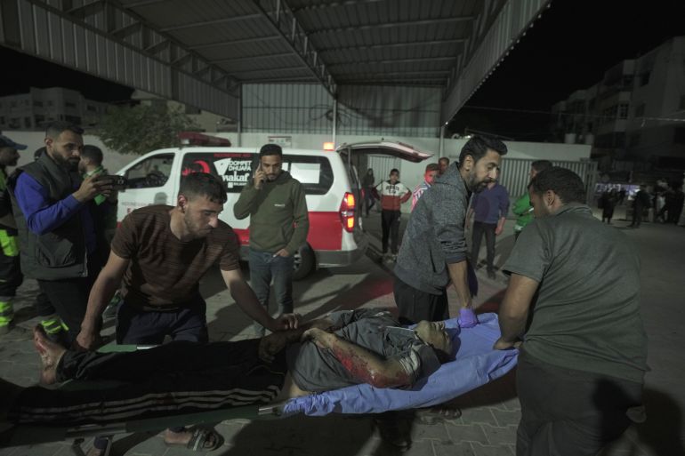 ap_69e9bf21d35c7-1776926497 Palestinians carry the body of a victim killed in an Israeli strike as they arrive at the Shifa Hospital in Gaza City, Wednesday, April 22, 2026. (AP Photo/Jehad Alshrafi)