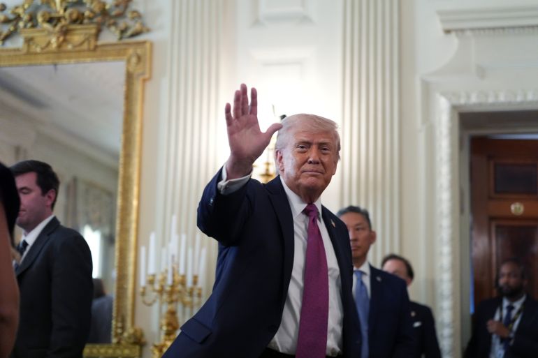 ap_69e9c750438f4-1776928592 President Donald Trump departs an event for NCAA national champions in the State Dining Room of the White House, Tuesday, April 21, 2026, in Washington. (AP Photo/Alex Brandon)