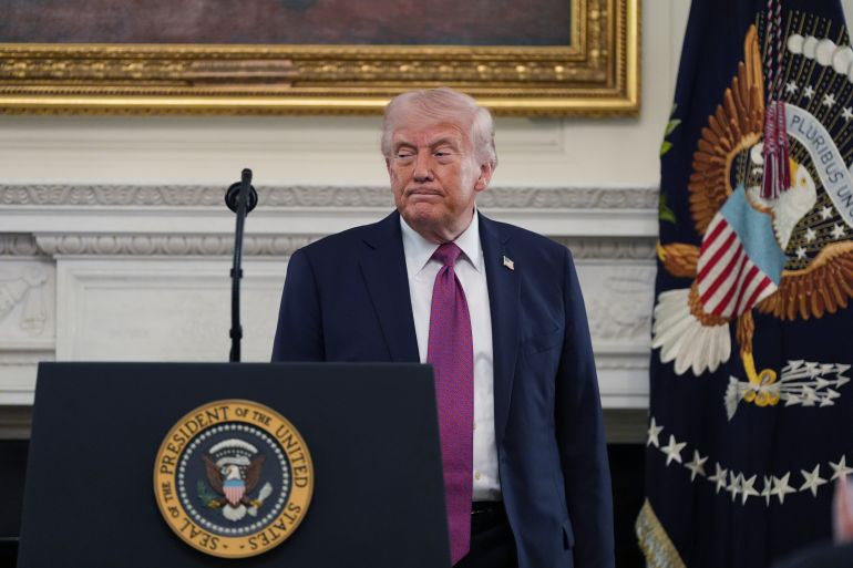 President Donald Trump gets ready to depart an event for NCAA national champions in the State Dining Room of the White House, Tuesday, April 21, 2026, in Washington. (AP Photo/Alex Brandon)