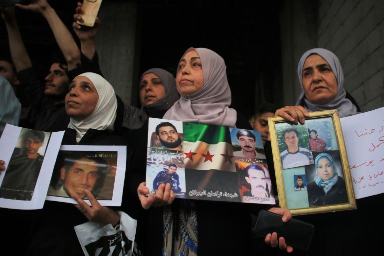 Relatives of victims of the killings known as the Tadamon massacre gather to demand the execution of Amjad Yousef, a former intelligence officer allegedly linked to the killings, after the Interior Ministry announced his arrest, in the Tadamon neighborhood of Damascus, Syria, Friday, April 24, 2026. (AP Photo/Omar Albam)