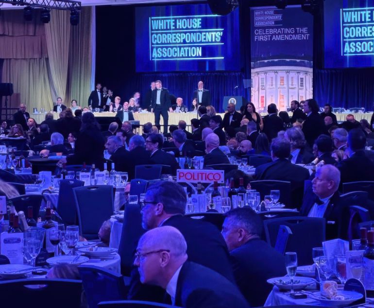U.S. Secret Service agents respond near President Donald Trump and first lady Melania Trump during the White House Correspondents Dinner, Saturday, April 25, 2026, in Washington. (AP Photo/Alex Brandon)