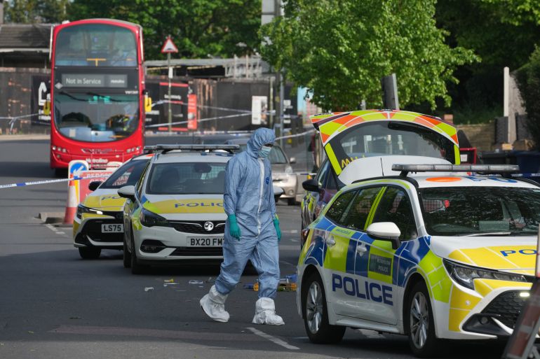 Forensic officers search the area after two people were stabbed in Golders Green neighborhood, that has a large Jewish community, in London, Wednesday, April 29, 2026.(AP Photo/Kin Cheung)