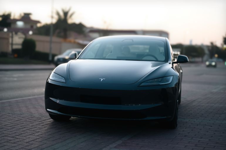 Dubai,UAE - January 7th 2023: Revolutionary Tesla Model 3 Variant Parked Elegance on Urban Road