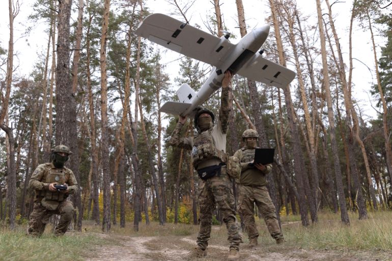 Ukrainian servicemen set up a 'Poseidon' drone before flying it towards Russian troop positions at an undisclosed location near the frontline in the Donetsk direction, Ukraine, on September 24, 2025, amid the ongoing Russian invasion. The Poseidon drone bomber, developed by the Ukrainian company Swarmly and approved for use by the Armed Forces in early 2025, is designed for reconnaissance and artillery correction, with features including high-altitude operation beyond most Russian air defenses, resistance to electronic warfare, autonomous return capability, vertical take-off and landing, and an operational range of up to 150 kilometers.