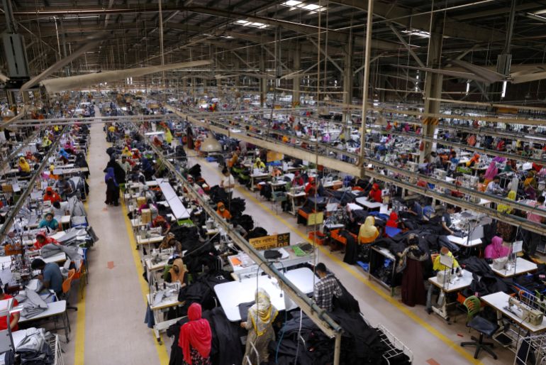 Bangladeshi garment workers make clothing in the sewing section of a factory in Gazipur, Bangladesh, April 9, 2025. REUTERS/Mohammad Ponir Hossain