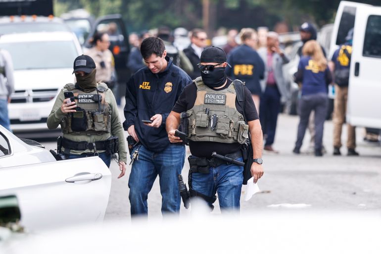epa12669131 Immigration and Customs Enforcement agents and other law enforcement officials investigate a reported federal agent-involved shooting near the intersection of 126th Street and Mona Boulevard in Willowbrook, California, USA, 21 January 2026. Federal agents with the Department of Homeland Security were conducting an operation in the area when a brief pursuit ended in a crash and shots were fired, authorities said, adding that no one was injured. EPA/CHRIS TORRES