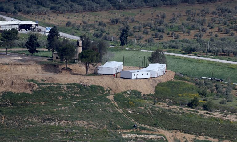 epa12840680 Caravans set up in the evacuated settlement of Sanur, near the West Bank village of Fandaqumiya, south of Jenin, which was attacked by Israeli settlers, 22 March 2026. Settlers set fire to residential buildings and vehicles overnight in seperate attacks on three villages, according to the Wafa news agency. EPA/ALAA BADARNEH