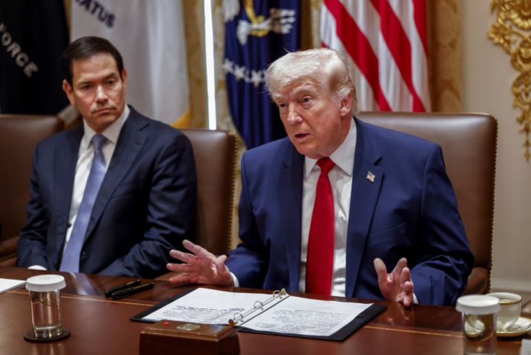 epa12851180 US Secretary of State Marco Rubio (L) looks on as US President Donald J. Trump delivers remarks during a Cabinet meeting in the Cabinet Room of the White House in Washington, DC, USA, 26 March 2026. EPA/WILL OLIVER / POOL