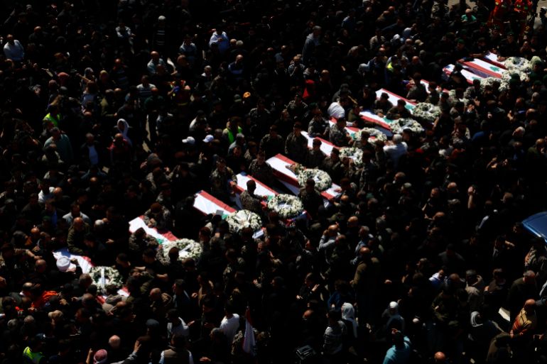 epa12882196 Mourners gather around the coffins of thirteen bodies from the Lebanese State Security Forces members during a funeral procession in the southern coastal city of Sidon, Lebanon, 11 April 2026. Thirteen members of Lebanon’s State Security Forces were killed in Israeli strikes on the Saraya Nabatieh government building on 10 April 2026. EPA/WAEL HAMZEH