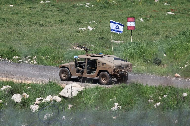 epa12907110 An Israeli military vehicle patrols inside the Syrian buffer zone, as seen from the village of Majdal Shams, in the Israeli-annexed Golan Heights, 22 April 2026. According to Israel's military, around 40 civilians infiltrated several hundred meters into the military-controlled buffer zone in Syria before being returned to Israel and taken into police custody. The incident occurred as Israel celebrated its 78th Independence Day. EPA/ATEF SAFADI