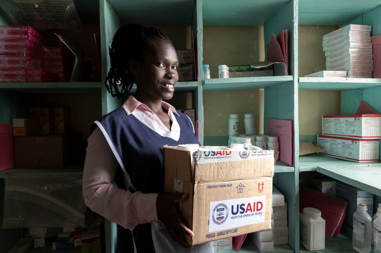 KISUMU, KENYA - APRIL 24: In the medical stockroom of Kuoyo Sub-county Hospital a nurse holds a USAID-labeled box containing ARVS antiretroviral medicine on April 24, 2025 in Kisumu, Kenya. Kisumu has one of the highest HIV rates in Kenya, with around 17.6% of the adult population are living with the virus, nearly five times the national average of 4.5%. In 2025, Kisumu has become a focal point of a growing healthcare crisis, as funding cuts from the United States Agency for International Development (USAID) ripple through the local health system. USAID sent KES 84.1 billion (around USD 600 million) to Kenya to support a range of sectors, including health, education, and economic development. KES 18.8 billion was allocated to HIV/AIDS programs, which served as a critical lifeline for high-burden regions like Kisumu. What appeared at first to be a bureaucratic adjustment as Donald Trump became president has translated to severe disruption of life-saving services. Clinics are shutting down, access to essential medicines is diminishing, and some mothers have been forced to ration antiretroviral treatments (ARVS), risking both their health and that of their children. Thousands of lives now hang in the balance, and without urgent, sustained intervention, the progress made in HIV prevention and treatment over the past two decades risks being rapidly undone. (Photo by Michel Lunanga/Getty Images)