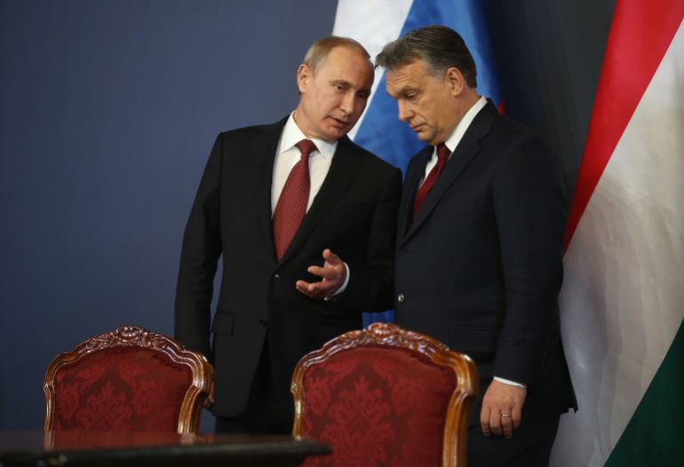 BUDAPEST, HUNGARY - FEBRUARY 17: Russian President Vladimir Putin (L) and Hungarian Prime Minister Viktor Orban converse during a signing ceremony of several agreements between the two countries at Parliament on February 17, 2015 in Budapest, Hungary. Putin is in Budapest on a one-day visit, his first to an EU-member country since he attended ceremonies marking the 70th anniversary of the D-Day invasions in France in June, 2014. (Photo by Sean Gallup/Getty Images)