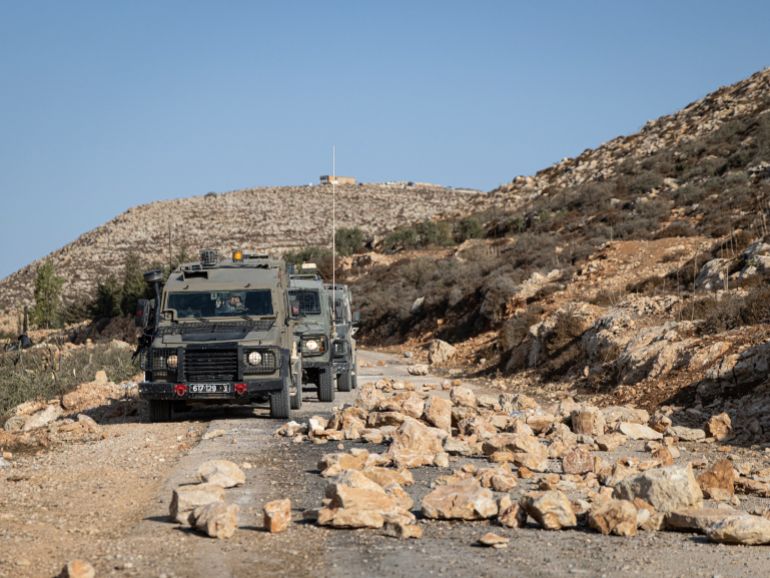 RAMALLAH, WEST BANK - OCTOBER 24: The Israeli army patrol close to the olive pickers to prevent clashes that may occur between Palestinians and settlers from nearby settlements on October 24, 2025 in Khirbet Abu Falah, Ramallah, West Bank. The West Bank's olive harvest season, which began earlier this month, is an important part of Palestinian culture and the local economy but increasingly precarious as Palestinians face attacks by Israeli settlers. According to the United Nations Office for the Coordination of Humanitarian Affairs (UNOCHA), around three dozen attacks on Palestinians across 27 villages in the second week of October were related to the ongoing harvest. Palestinians also face roadblocks and other impediments imposed by Israeli security forces that prevent them from accessing their land. (Photo by Faiz Abu Rmeleh/Getty Images)