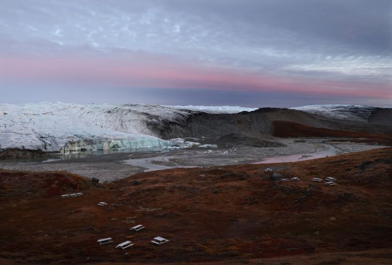 KANGERLUSSUAQ, GREENLAND - SEPTEMBER 08: Moraine (CENTER R) is left behind by the retreating Reindeer Glacier on September 8, 2021 near Kangerlussuaq, Greenland. 2021 will mark one of the biggest ice melt years for Greenland in recorded history. Researchers from Denmark estimated that in July of this year enough ice melted on the Greenland Ice Sheet to cover the entire state of Florida with two inches of water. According to NASA, 5 trillion tons of ice have melted in Greenland over approximately the past 15 years, enough to increase global sea level by nearly an inch. The observations come on the heels of the recent United Nations report on global warming which stated that accelerating climate change is driving an increase in extreme weather events. (Photo by Mario Tama/Getty Images)