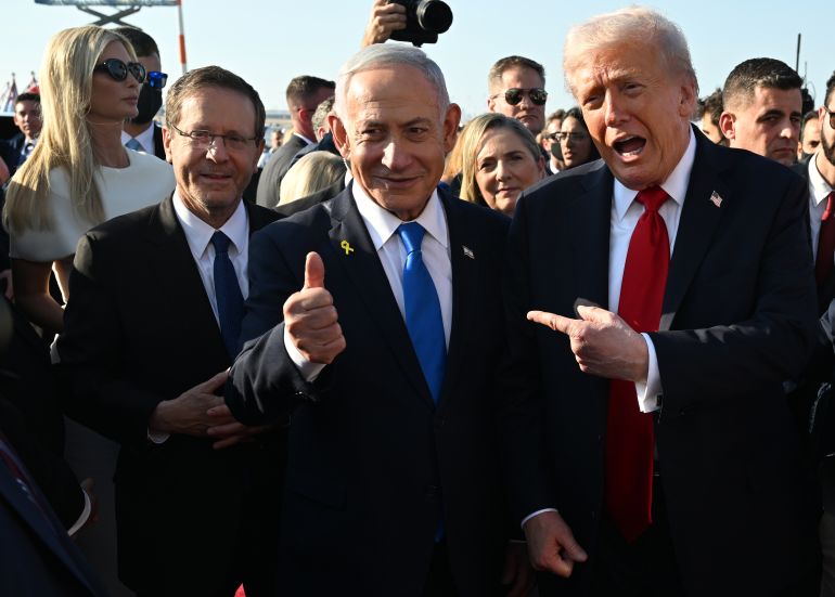 getty_6990c82ace-1771096106 TEL AVIV, ISRAEL - OCTOBER 13: U.S. President Donald Trump poses with Israeli President Isaac Herzog and Israeli Prime Minister Benjamin Netanyahu at Ben Gurion International Airport before boarding his plane to Sharm El-Sheikh, on October 13, 2025 in Tel Aviv, Israel. President Trump is visiting the country hours after Hamas released the remaining Israeli hostages captured on Oct. 7, 2023, part of a US-brokered ceasefire deal to end the war in Gaza. (Photo by Chip Somodevilla/Getty Images)