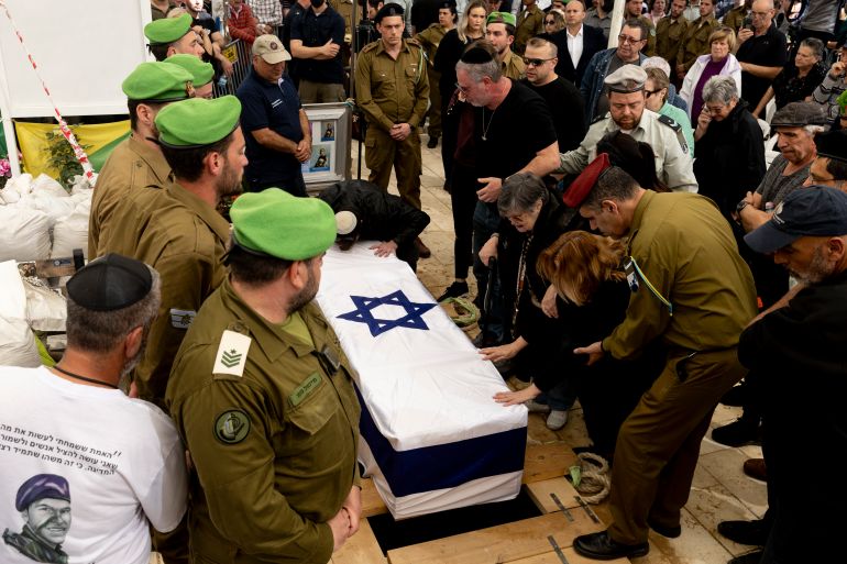 getty_69cc23d6cb-1774986198-1 HOLON, ISRAEL - MARCH 31: Family members and friends mourn during the funeral for Israeli soldier, Staff Sgt. Maxsim Entis, who was killed in a battle in Southern Lebanon a day ago, among three more Israeli soldiers on March 31, 2026 in Holon, Israel. Israel and Hezbollah have continued exchanging hostilities across Israel's northern border with Lebanon, after the Iran-backed militant group began launching missiles at Israel on March 2, in what it said was retaliation for the joint U.S.-Israeli war on Iran. (Photo by Amir Levy/Getty Images)