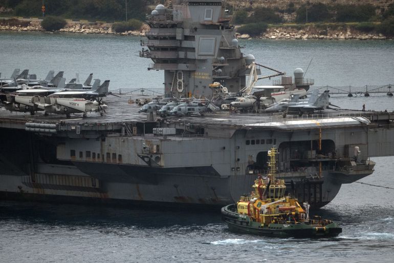 SOUDA, GREECE - MARCH 23: The United Stated Navy aircraft carrier USS Gerald R. Ford arrives in Souda Bay on March 23, 2026 in Souda, Greece. The USS Gerald R. Ford is undergoing repairs at Naval Support Activity Souda Bay on the Greek island of Crete, following a fire that reportedly broke out in a laundry room on the aircraft carrier earlier this month, injuring some sailors and causing significant damage. The vessel has also had issues with its toilet system. Since departing Norfolk, Virginia on June 24 last year, the Ford has been deployed to the Mediterranean, Caribbean, and most recently the Red Sea as part of U.S. operations against Iran, and is currently on course to become the longest deployed carrier since the Vietnam War. (Photo by Carl Court/Getty Images)