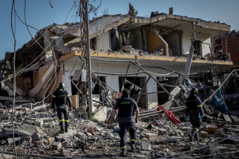 NABATIEH, LEBANON - APRIL 13: Firefighters search a building for survivors minutes after an Israeli airstrike on April 13, 2026 in Nabatieh, Lebanon. Continued Israeli bombardment of Nabatieh has turned the city into a ghost town, most of the cities residents have left, for medical teams working in the city comes at huge risk. In recent weeks ambulances, rescue crews and paramedics across Lebanon have come under repeated Israeli attacks. On March 25 two members of the Nabatieh Medics, Joud Mohammed Suleiman (16) and Ali Jaber (22) were killed in a targeted Israeli drone strike, despite wearing their medical uniforms and being clearly marked as paramedics. Further strikes on medical workers in villages across Lebanon has pushed the death toll of first responders to over fifty since the start of the war in early March. (Photo by Chris McGrath/Getty Images)