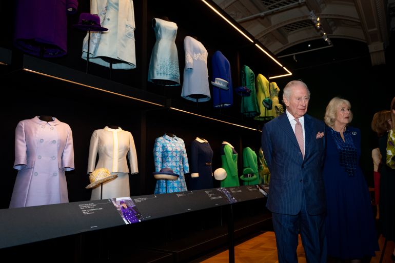LONDON, ENGLAND - APRIL 20: King Charles III and Queen Camilla during a visit to the Queen Elizabeth II: Her Life in Style exhibition at The King's Gallery at Buckingham Palace on April 20, 2026 in London, England. The exhibition is the largest and most comprehensive display of Elizabeth II's fashion ever mounted as part of events commemorating the 100th anniversary of the late monarch's birth. (Photo by Aaron Chown - Pool/Getty Images)