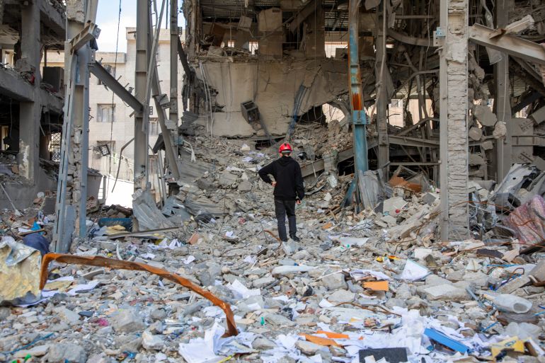 TEHRAN, IRAN - APRIL 6: A man walks among buildings destroyed in a joint attack by Israel and the United States on April 6, 2026, in Tehran, Iran. The United States and Israel continue their joint attack on Iran that began on February 28. Iran retaliated by firing waves of missiles and drones at Israel, and targeting U.S. allies in the region. (Photo by Majid Saeedi/Getty Images)