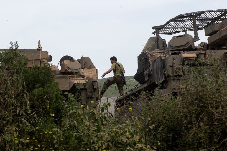 getty_69e9ecd856-1776938200 NORTHERN ISRAEL, ISRAEL - APRIL 17: An Israeli soldier jumps between armored personnel carriers near the border with Lebanon on April 17, 2026 in Northern Israel, Israel. At 00:00 on April 17, a 10-day ceasefire took effect that is meant to pause fighting between Israeli forces and the Lebanese militant group Hezbollah. The agreement was announced the night before by U.S. President Donald Trump and described as a ceasefire between Israel and Lebanon; Hezbollah acknowledged the ceasefire but did not directly confirm it would abide by it. (Photo by Amir Levy/Getty Images)