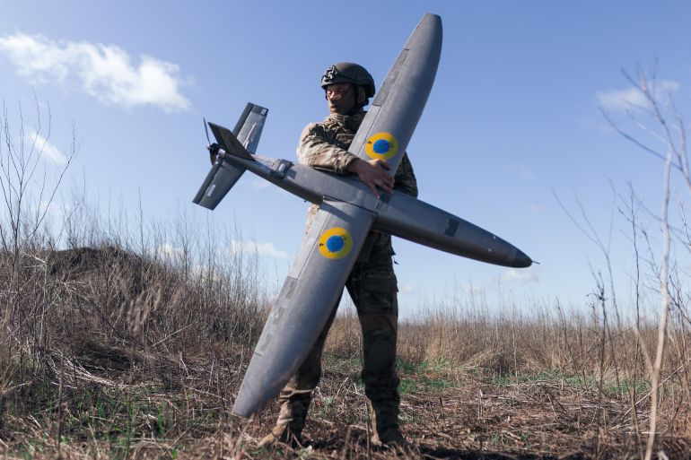 KHARKIV REGION, UKRAINE - APRIL 7: A portrait of a soldier from the "Taifun" unmanned aerial vehicle unit holding a new model 'Marsianin' attack drone on April 7, 2026 in Kharkiv region, Ukraine. After years of developing systems and know-how to fend off Russia's drone attacks, Ukraine is now offering its hard-won expertise and counter-drone technology to other countries. In recent weeks, Ukrainian President Volodymyr Zelensky has been visiting Gulf states who are confronting a wave of relatively cheap kamikaze drones launched by Iran as it lashes out neighboring countries after the joint U.S.-Israeli attack. (Photo by Nikoletta Stoyanova/Getty Images)