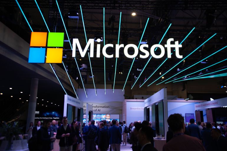 The Microsoft logo is on display at the Mobile World Congress in Barcelona, Spain, on February 26, 2024. The 2024 edition of the Mobile World Congress, which is focusing on artificial intelligence and the new uses of 5G and 6G, is currently underway. The congress is also presenting the first flying car, and artificial intelligence applications are taking center stage. The organizers are expecting to attract 95,000 visitors to this edition. (Photo by Charlie Perez/NurPhoto via Getty Images)
