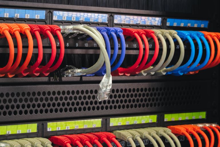 cables with different colors numbers. Cables are connected to black box, one cable is not connected, broken connection, no connection, disconnected internet communication problem concept background