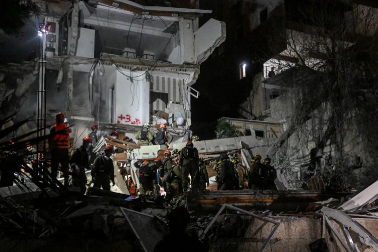 First responders work at the site of a projectile impact, as the U.S.-Israel conflict with Iran continues, in northern Israel, April 5, 2026. REUTERS/Rami Shlush ISRAEL OUT. NO COMMERCIAL OR EDITORIAL SALES IN ISRAEL TPX IMAGES OF THE DAY