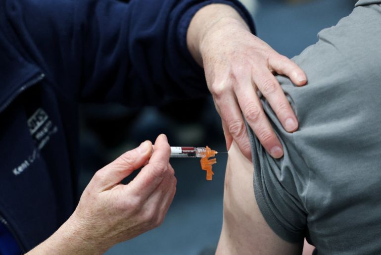 Natalie Allgrove, of the Kent Community Health NHS Trust immunisation team, administers a Meningitis B vaccination to student May Croxton, at a sports centre on the University of Kent campus, following an outbreak of meningitis cases in Kent, in Canterbury, Britain, March 20, 2026. REUTERS/Toby Melville