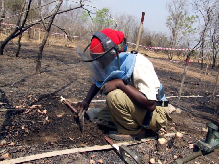 pic-9998771-1775271063 Joanne Jenty, a deminer, searches for mines in the earth before her in the Mile 38 battlefield, 38 miles (61 km) from the southern capital Juba, February 2008. Seven months pregnant Opayi Mary stands half a metre away from a mine made expressly to blow anything over three kg to pieces. For her, it's just part of a day's work. Mary leads an all-female team of deminers including Jenty working for Norwegian People's Aid (NPA) in one of south Sudan's most dangerous areas: the civil war battlefield Mile 38. The location was on the frontline in a decades-long conflict between mainly Christian and animist southern rebels and the Islamist government in Khartoum. Picture taken February 2008. To match feature SUDAN-DEMINING/ REUTERS/Skye Wheeler (SUDAN)