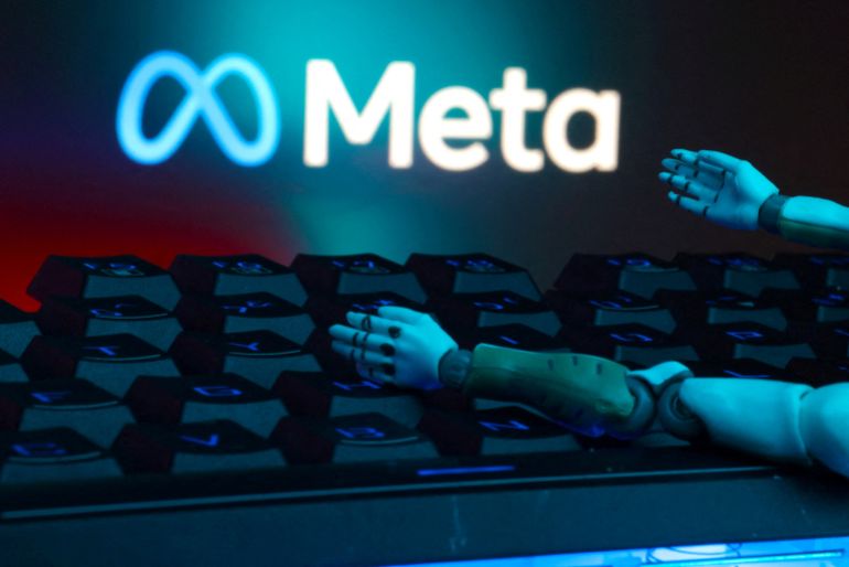 rc2licapigl8-1744228354 FILE PHOTO: Illustration shows Meta logo, keyboard and robot hands