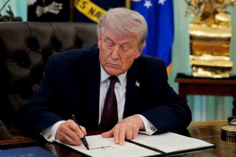 reuters_69cd43d9-1775059929 FILE PHOTO: U.S. President Donald Trump signs an executive order on mail ballots, in the Oval Office of the White House in Washington, D.C., March 31, 2026. REUTERS/Evan Vucci/File Photo