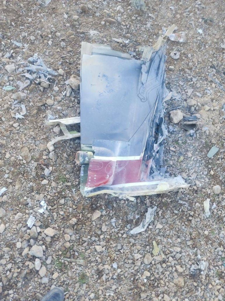 The Iranian state media said to show fragments of a downed U.S. jet in this picture said to be taken in central Iran and released on April 3, 2026. IRIB/Handout via REUTERS THIS IMAGE HAS BEEN SUPPLIED BY A THIRD PARTY. IRAN OUT. NO COMMERCIAL OR EDITORIAL SALES IN IRAN. NO USE BBC PERSIAN. NO USE VOA PERSIAN. NO USE MANOTO. NO USE IRAN INTERNATIONAL. NO USE RADIO FARDA. REFILE - CORRECTING FROM "JETS" TO "JET" VERIFICATION: -Reuters was not able to confirm the location or date when the photos were taken. -The red stripe seen on the tail fin of the plane in the photos is consistent with the tail section of a F-15E Strike Eagle seen in file photos.