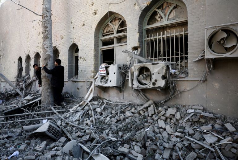 FILE PHOTO: People stand amidst the rubble of a building of the Sharif University of Technology, which was damaged in a strike, amid the U.S.-Israeli conflict with Iran, in Tehran, Iran, April 7, 2026. Majid Asgaripour/WANA (West Asia News Agency) via REUTERS ATTENTION EDITORS - THIS PICTURE WAS PROVIDED BY A THIRD PARTY/File Photo