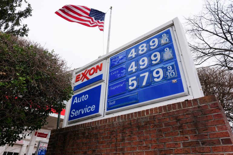 FILE PHOTO: A board displays gasoline prices amid the ongoing conflict with US-Israeli conflict with Iran, in Washington D.C., U.S., March 15, 2026. REUTERS/Aaron Schwartz/File Photo