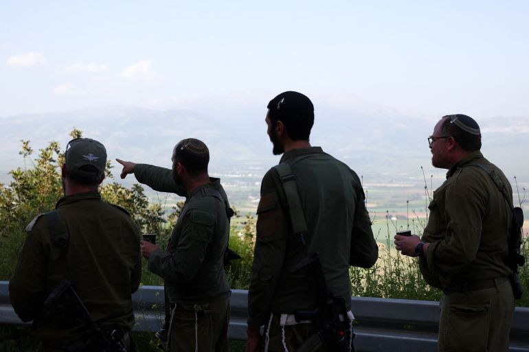 Israeli soldiers stand near the Israel-Lebanon border, in Israel, April 16, 2026. REUTERS/Florion Goga
