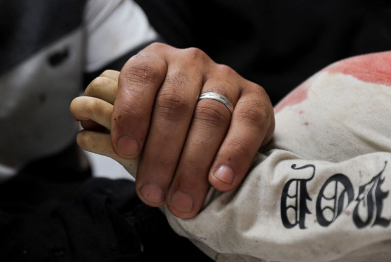 SENSITIVE MATERIAL. THIS IMAGE MAY OFFEND OR DISTURB A father mourns next to the body of his three‑year‑old child, Yahya Al‑Malahi, who was killed in an Israeli strike, according to medics, in Gaza City, April 14, 2026. REUTERS/Dawoud Abu Alkas