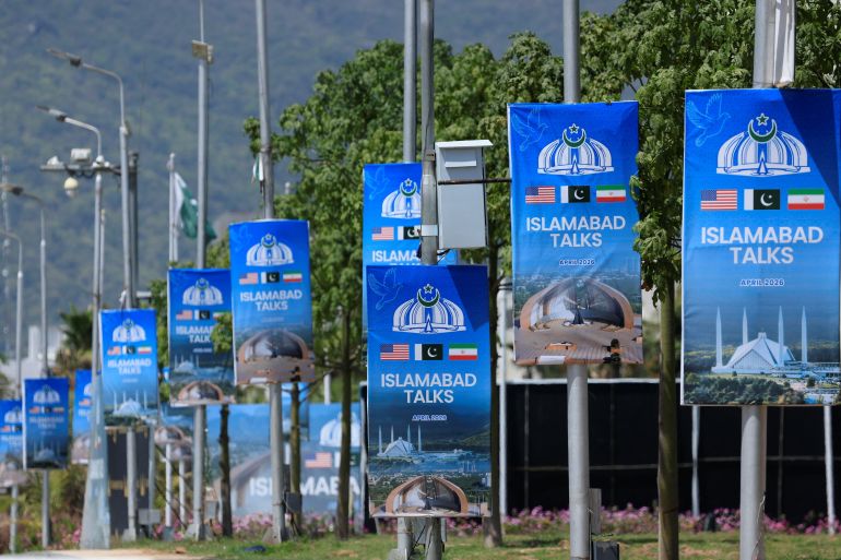 Hoardings are mounted on lamp posts, as Pakistan prepares to host the United States and Iran for a possible second phase of peace talks in Islamabad, Pakistan, April 20, 2026. REUTERS/Akhtar Soomro