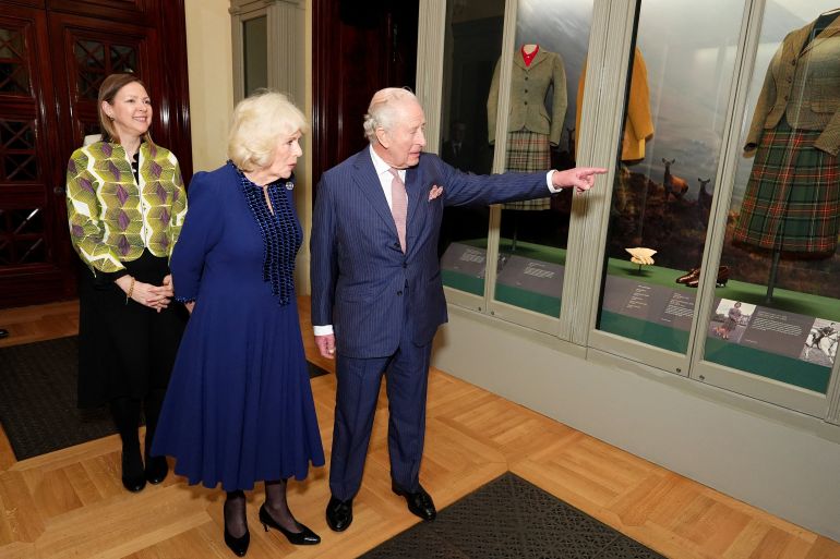 Britain's King Charles and Queen Camilla with Caroline de Guitaut, exhibition curator and Surveyor of The King’s Works of Art, during a visit to the Queen Elizabeth II: Her Life in Style exhibition at The King's Gallery, Buckingham Palace, London, Britain April 20, 2026. Aaron Chown/Pool via REUTERS