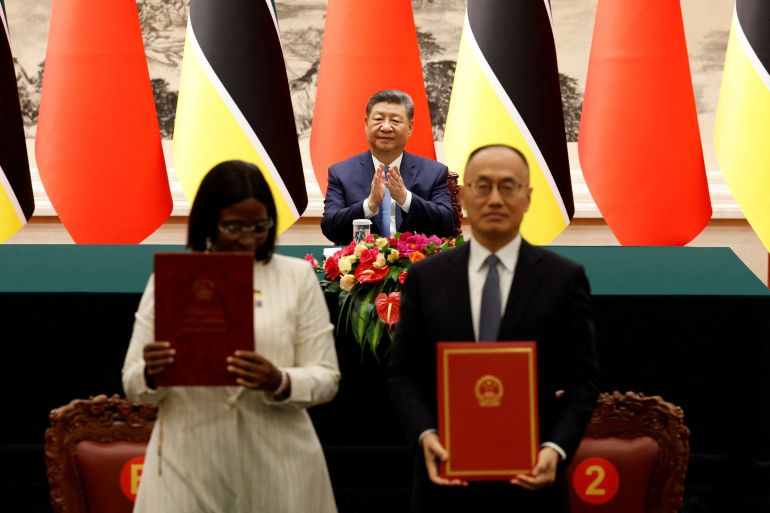 China's President Xi Jinping applauds during a signing ceremony with Mozambique's President Daniel Chapo (not pictured) at the Great Hall of the People in Beijing, China April 21, 2026. Haruna Furuhashi/Pool via REUTERS