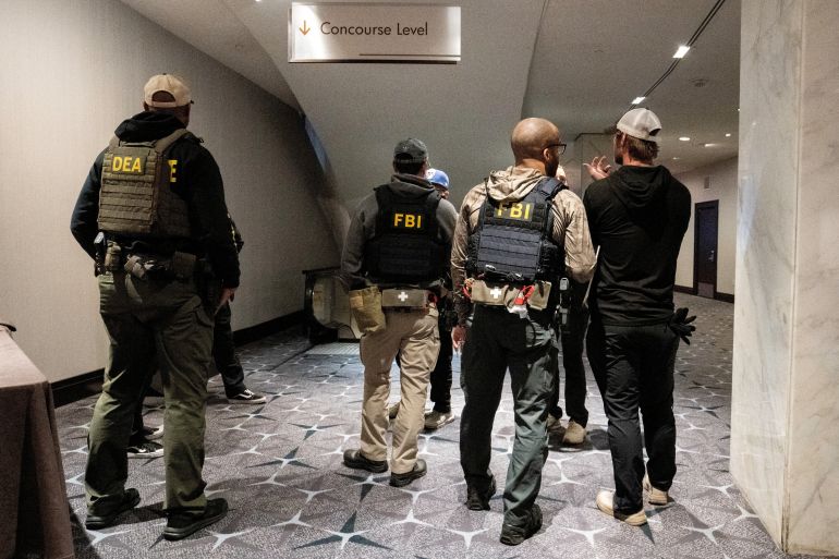 Law enforcement personnel patrol the venue, following a shooting incident during the annual White House Correspondents' Association dinner, in Washington, D.C., U.S., April 26, 2026. REUTERS/Ken Cedeno REFILE - CORRECTING DATE FROM "APRIL 25" TO "APRIL 26".