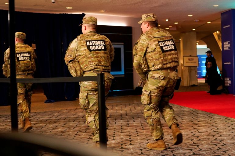 Members of the National Guard run next to the red carpet as a shooter opens fire during the annual White House Correspondents' Association dinner, in Washington, D.C., U.S., April 25, 2026. REUTERS/Elizabeth Frantz