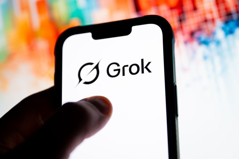 POLAND - 2025/12/04: In this photo illustration, a Grok logo seen displayed on a smartphone. (Photo Illustration by Mateusz Slodkowski/SOPA Images/LightRocket via Getty Images)