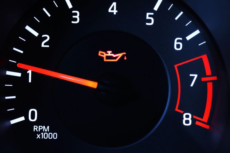 Oil pressure warning light illuminated on dashboard.
